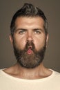 Man with long beard on emotional grimace face