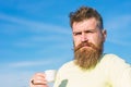 Man with long beard enjoy coffee. Coffee gourmet concept. Bearded man with espresso mug, drinks coffee. Man with beard