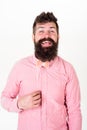 Man with long beard holding red paper bowtie. Bearded man smiling on white background. Hipster in pink shirt with trendy Royalty Free Stock Photo