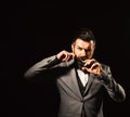 Man with long beard holds scissors. Macho in formal suit Royalty Free Stock Photo