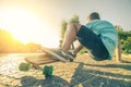 Man on longboard at sunset