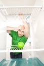 Man looking at apple in fridge Royalty Free Stock Photo