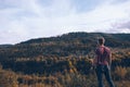 man looking at autumn forest mountains Royalty Free Stock Photo