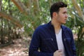 Man looking away from camera with unzipped jacket