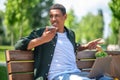 Man looking away saying message on smartphone Royalty Free Stock Photo