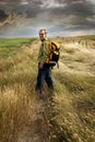 Man looking back and smiling on a country road Royalty Free Stock Photo