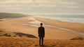Man Looking At Beach In Traditional British Landscape Style