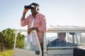 Man looking through binoculars at countryside Royalty Free Stock Photo