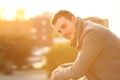 Man looking at camera in a balcony in winter Royalty Free Stock Photo