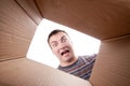 Man looking into cardboard box Royalty Free Stock Photo