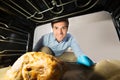Man Looking At Chicken View From Inside The Oven Royalty Free Stock Photo