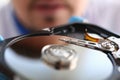 Man looking at compact disk reader out of computer Royalty Free Stock Photo