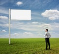 Man looking at empty billboard Royalty Free Stock Photo