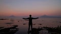 Man looking at the erupting volcano Calbuco in Frutillar, Chile.