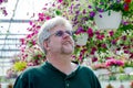 Man looking for flowering baskets