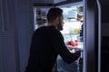 Man Looking At Food Kept In Refrigerator Royalty Free Stock Photo