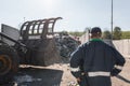 Man looking at garbage at landfill Royalty Free Stock Photo