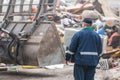 Man looking at garbage at landfill Royalty Free Stock Photo