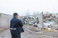 Man looking at garbage at landfill Royalty Free Stock Photo