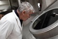 Man looking through the hatch of the tank Royalty Free Stock Photo