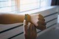 Man looking with heart rate monitor and using workout mode at smartwatch after wake up in the morning Royalty Free Stock Photo