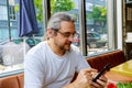 Man looking at his hands with smartphone texting message or dialing Royalty Free Stock Photo