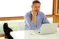 Man looking at his laptop computer at home Royalty Free Stock Photo