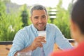 Man looking at his lovely wife while having breakfast