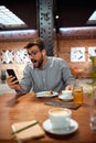 man looking at his phone and making a suprise face excpression Royalty Free Stock Photo