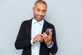 Man looking at his smart phone while text messaging Royalty Free Stock Photo