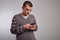 Man looking at his smart phone while text messaging Royalty Free Stock Photo