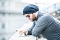 Man looking at his tablet and scrolling with hand