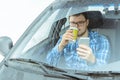 Man looking info in phone while sitting in car Royalty Free Stock Photo