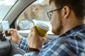 Man looking info in phone while sitting in car Royalty Free Stock Photo
