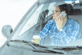 Man looking info in phone while sitting in car Royalty Free Stock Photo