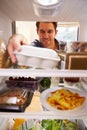 Man Looking Inside Fridge Filled With Food And Choosing Eggs Royalty Free Stock Photo