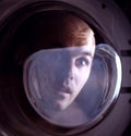 Man looking inside washing machine Royalty Free Stock Photo