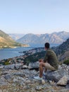 Man is looking at Kotor bay from above in Kotor, Montenegro Royalty Free Stock Photo