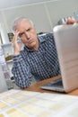 Man looking at laptop troubled expression Royalty Free Stock Photo