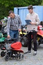 man looking at lawn mower blade Royalty Free Stock Photo