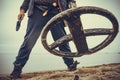 Man with metal detector on sea beach Royalty Free Stock Photo