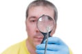 Man looking at mite through magnifier, isolated on white background