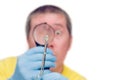 Man looking at mite through magnifier, on white background