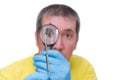 Man looking at mite through magnifier, on white background