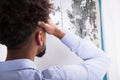 Man Looking At Mold On Wall Royalty Free Stock Photo