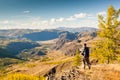 A Man looking at the Mountains from Viewpoint.