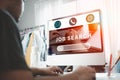 Man looking at an online website on a desk in home after unemployed. Job search Royalty Free Stock Photo