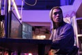 Man looking over shoulder while hacking