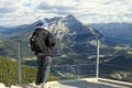 Man looking at a panorama of a small town Banff in a Bow river valley Royalty Free Stock Photo