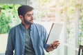 A man looking at paper note while working Royalty Free Stock Photo